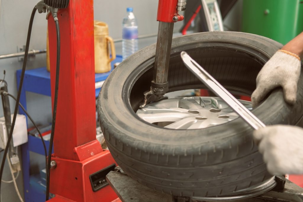 technician performing tire repair